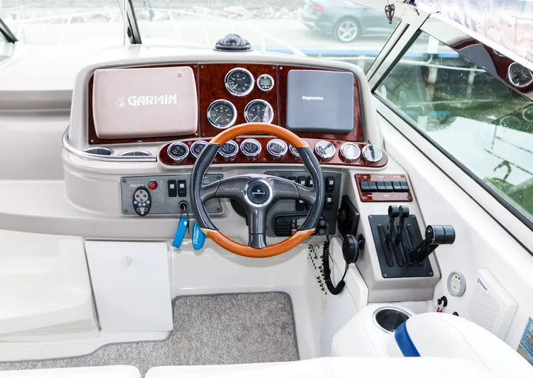  Yacht Photos Pics 2003 Formula 370 Super Sport boat cockpit with Garmin navigation system.