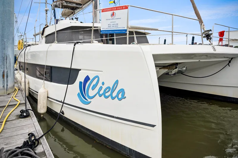 Cielo Yacht Photos Pics 2023 Bali 4.2 catamaran named "Cielo" docked, available for sale.