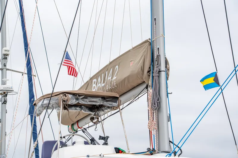 Cielo Yacht Photos Pics Sailboat Bali 4.2 (2023) with American and Bahamian flags, mast and rigging visible.