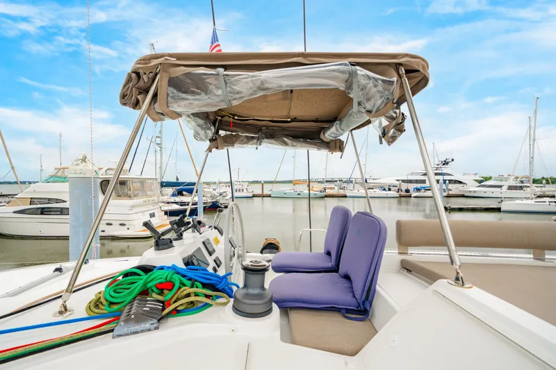 Cielo Yacht Photos Pics 2023 Bali 4.2 yacht interior with seating, ropes, and marina view.