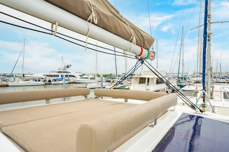 Cielo Yacht Photos Pics Modern 2023 Bali 4.2 yacht in marina, featuring spacious deck and luxurious seating.