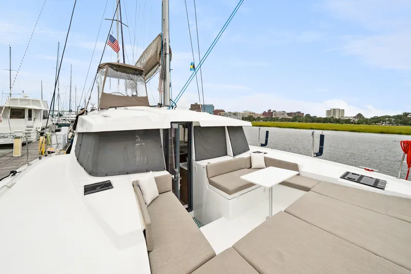 Cielo Yacht Photos Pics 2023 Bali 4.2 catamaran with spacious deck seating, docked in a marina.