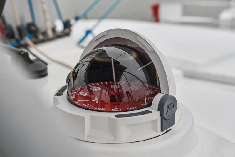Cielo Yacht Photos Pics Close-up of a 2023 Bali 4.2 yacht compass, featuring a red dial.