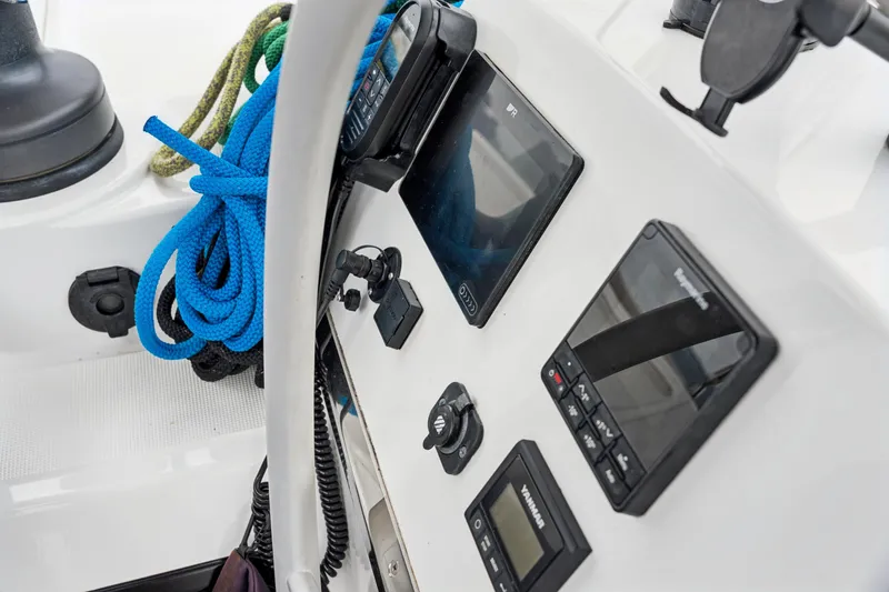 Cielo Yacht Photos Pics Control panel of 2023 Bali 4.2 boat with navigation equipment and blue ropes.