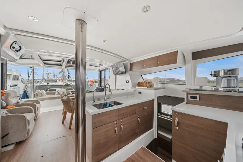 Cielo Yacht Photos Pics Modern interior of 2023 Bali 4.2 yacht with kitchen and seating area.