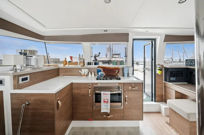 Cielo Yacht Photos Pics Modern kitchen interior of 2023 Bali 4.2 yacht with wood accents and ocean view.