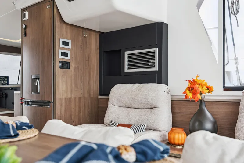 Cielo Yacht Photos Pics Luxurious interior of 2023 Bali 4.2 yacht with cozy seating and autumn decor.