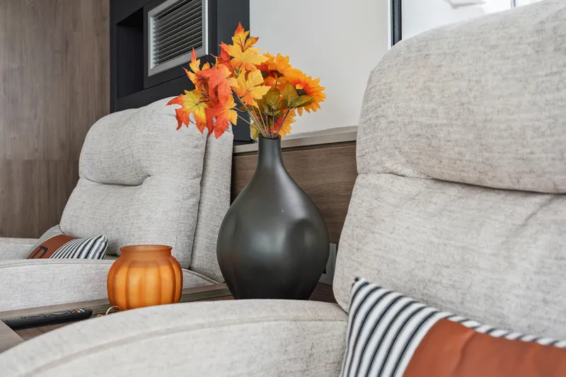 Cielo Yacht Photos Pics Cozy living room with beige chairs, autumn flowers, and decorative vase, Bali 4.2, 2023.