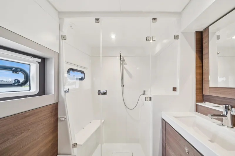 Cielo Yacht Photos Pics Modern bathroom in 2023 Bali 4.2 yacht with sleek shower and wooden accents.