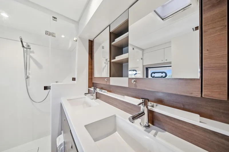 Cielo Yacht Photos Pics Modern bathroom interior on 2023 Bali 4.2 yacht, featuring dual sinks and sleek shower design.