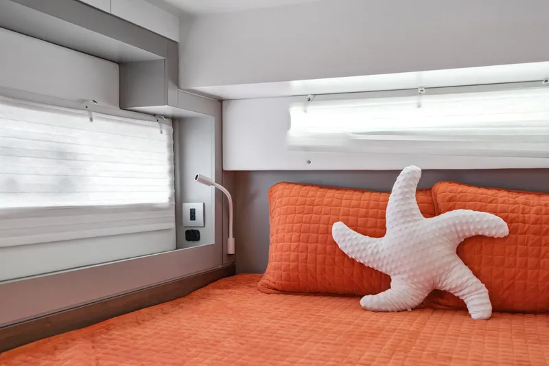 Cielo Yacht Photos Pics Cozy Bali 4.2 yacht cabin with orange bedding and starfish pillow, 2023 model.