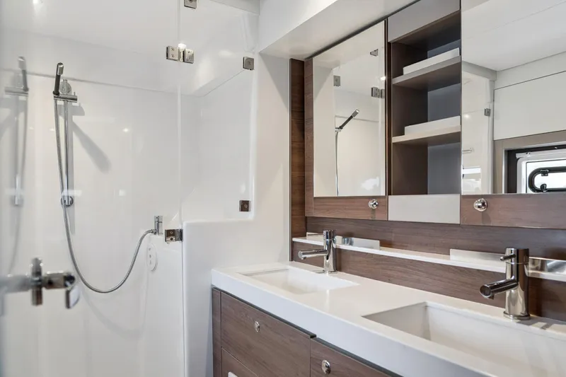 Cielo Yacht Photos Pics Modern bathroom interior on 2023 Bali 4.2 yacht, featuring dual sinks and sleek shower design.