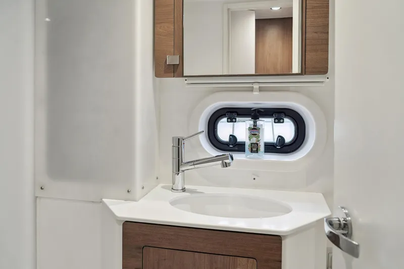 Cielo Yacht Photos Pics Modern bathroom interior in 2023 Bali 4.2 yacht, featuring sleek sink and mirror.