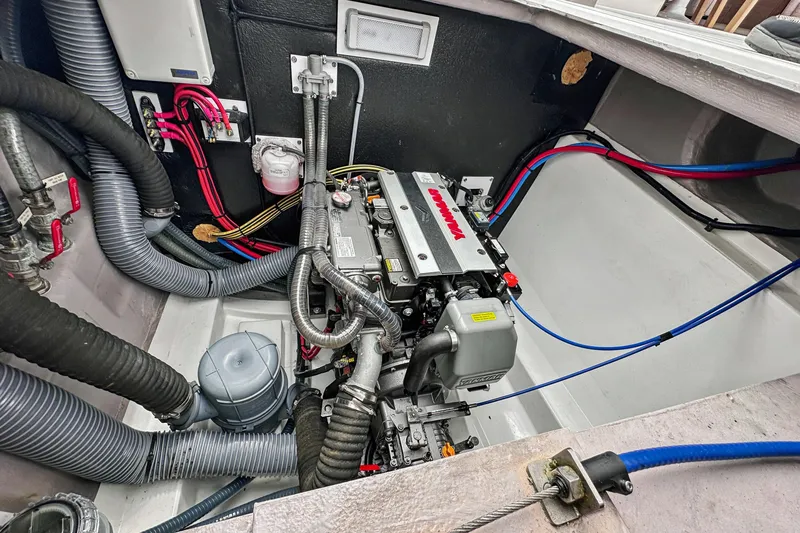 Cielo Yacht Photos Pics Engine compartment of 2023 Bali 4.2 boat, featuring Yanmar engine and various hoses.