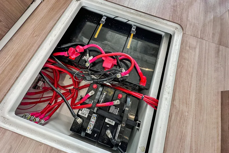 Cielo Yacht Photos Pics Battery compartment of a 2023 Bali 4.2 with red cables and connections.