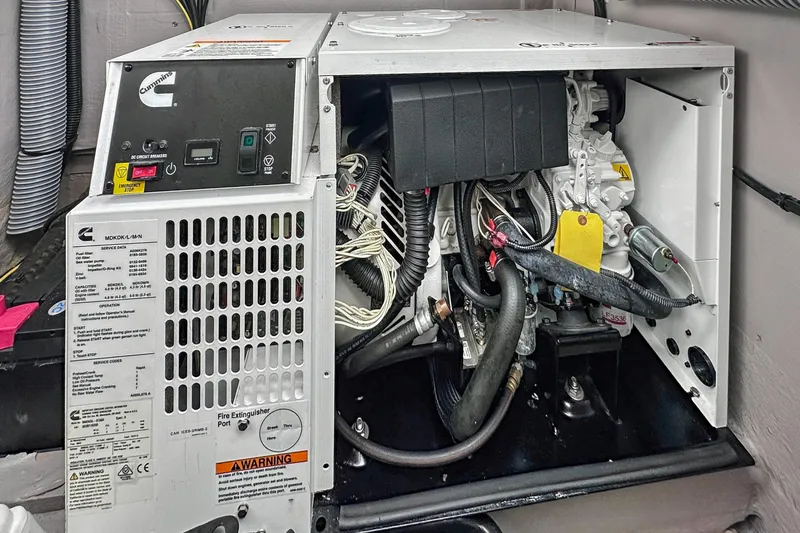 Cielo Yacht Photos Pics Cummins generator inside a Bali 4.2 model, 2023, showing engine components and control panel.