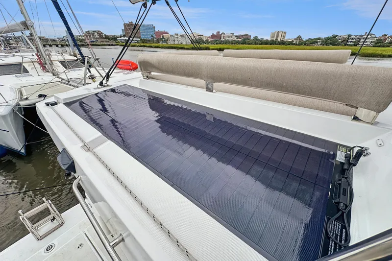 Cielo Yacht Photos Pics 2023 Bali 4.2 catamaran with solar panel on deck, docked in a marina.