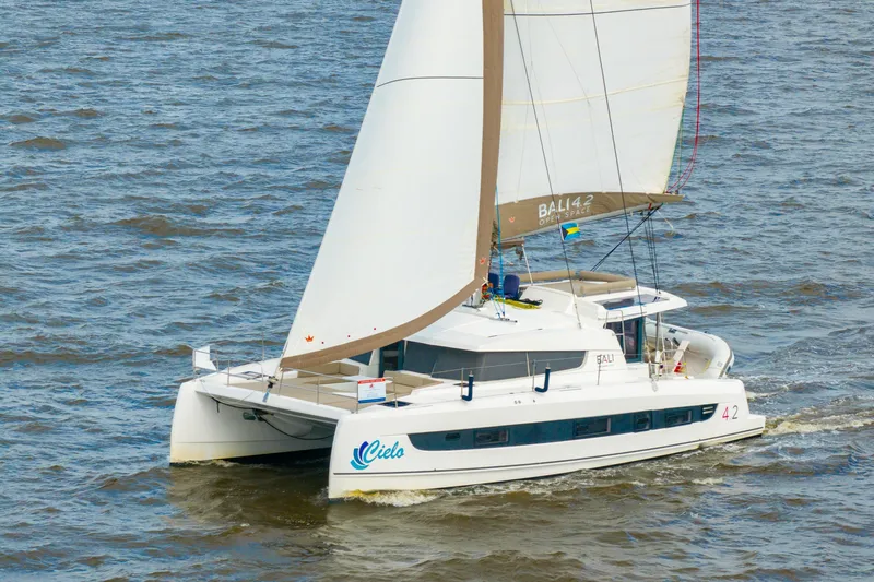 Cielo Yacht Photos Pics 2023 Bali 4.2 catamaran sailing on open water, showcasing sleek design and spacious deck.