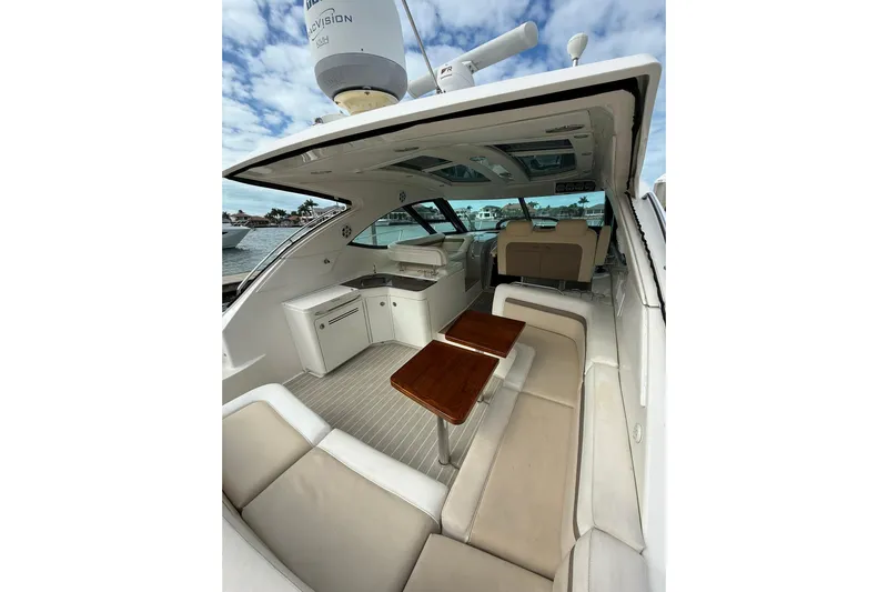  Yacht Photos Pics Luxurious 2014 Sea Ray 470 Sundancer yacht interior with elegant seating and wooden tables.