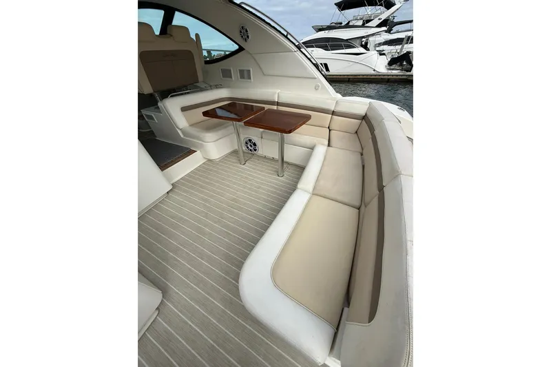  Yacht Photos Pics 2014 Sea Ray 470 Sundancer yacht interior with elegant seating and wooden tables.