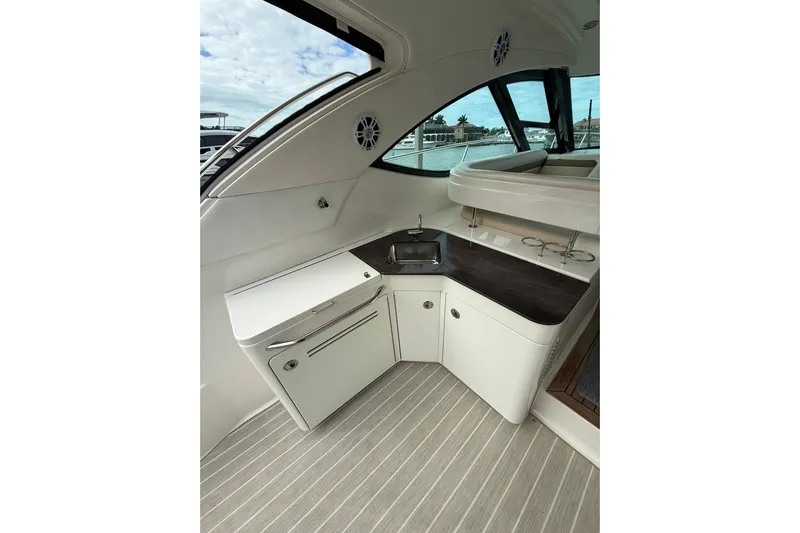  Yacht Photos Pics Interior view of 2014 Sea Ray 470 Sundancer yacht with kitchenette and sink.