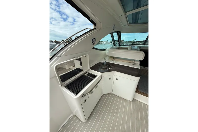 Yacht Photos Pics 2014 Sea Ray 470 Sundancer yacht interior with kitchenette and sleek design.