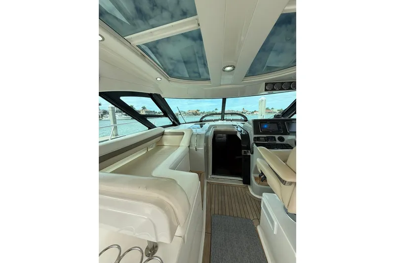  Yacht Photos Pics Interior of 2014 Sea Ray 470 Sundancer yacht with luxurious seating and modern helm.