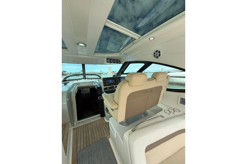  Yacht Photos Pics Interior view of 2014 Sea Ray 470 Sundancer yacht with helm and seating.