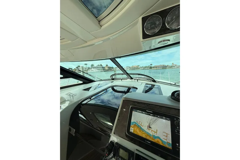  Yacht Photos Pics Interior view of 2014 Sea Ray 470 Sundancer yacht cockpit with navigation system.