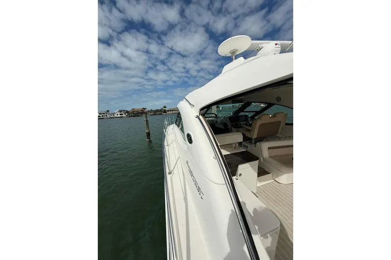  Yacht Photos Pics 2014 Sea Ray 470 Sundancer yacht docked, showcasing sleek design and luxurious interior.