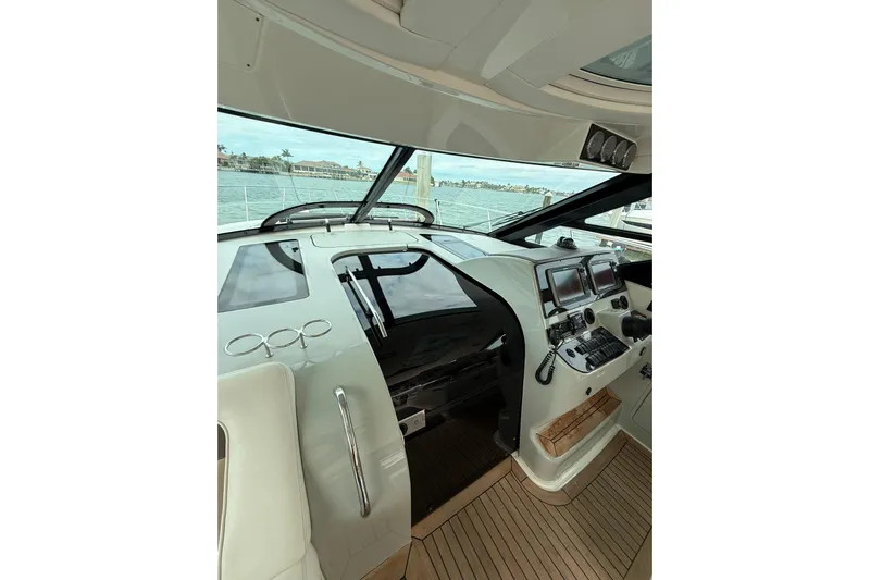  Yacht Photos Pics 2014 Sea Ray 470 Sundancer helm with modern navigation equipment and panoramic water views.