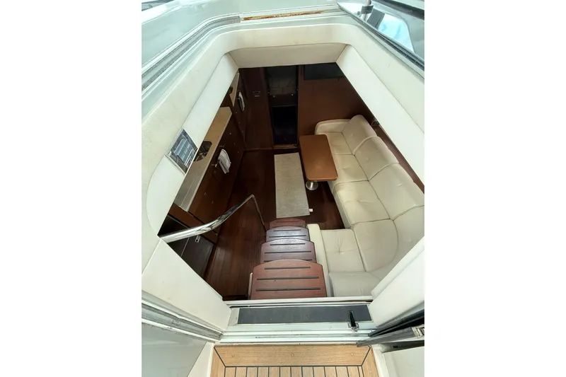  Yacht Photos Pics Interior view of 2014 Sea Ray 470 Sundancer yacht, featuring a cozy seating area.