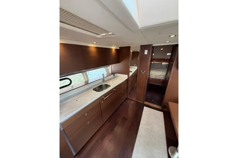 Yacht Photos Pics Luxurious interior of 2014 Sea Ray 470 Sundancer yacht with modern kitchen design.