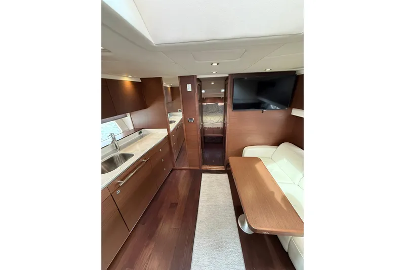  Yacht Photos Pics Interior of 2014 Sea Ray 470 Sundancer yacht with modern kitchen and seating area.