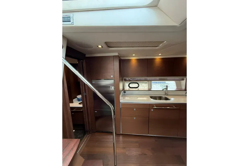  Yacht Photos Pics Luxurious interior of 2014 Sea Ray 470 Sundancer yacht with modern kitchen amenities.