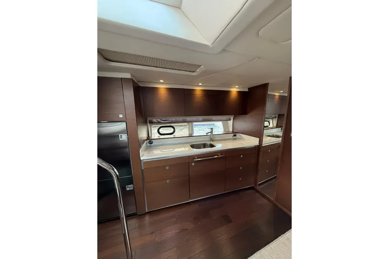  Yacht Photos Pics Luxurious interior of 2014 Sea Ray 470 Sundancer yacht with modern kitchen amenities.