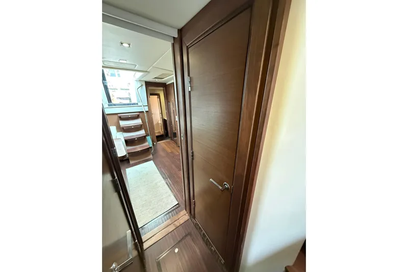  Yacht Photos Pics Interior hallway of 2014 Sea Ray 470 Sundancer yacht with wooden finishes.