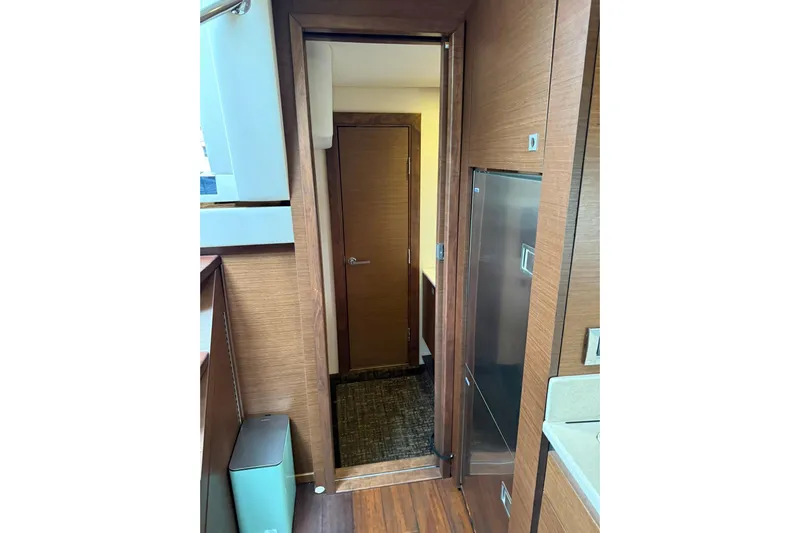  Yacht Photos Pics Interior view of 2014 Sea Ray 470 Sundancer yacht, featuring wooden cabinetry and modern design.