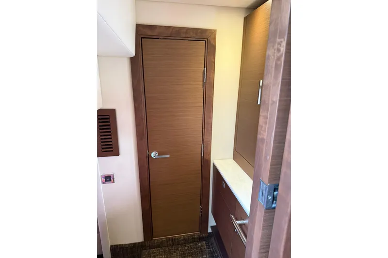 Yacht Photos Pics Interior view of 2014 Sea Ray 470 Sundancer yacht with wooden door and cabinetry.