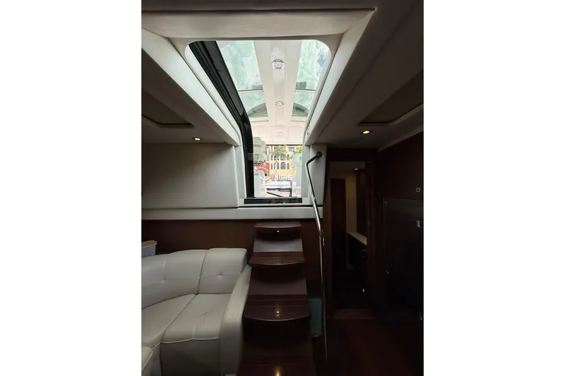  Yacht Photos Pics Interior view of 2014 Sea Ray 470 Sundancer yacht with skylight and stairs.