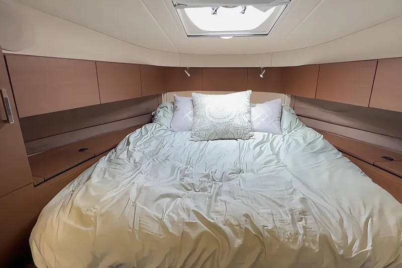  Yacht Photos Pics Luxurious bedroom interior of 2014 Sea Ray 470 Sundancer yacht with cozy bedding.