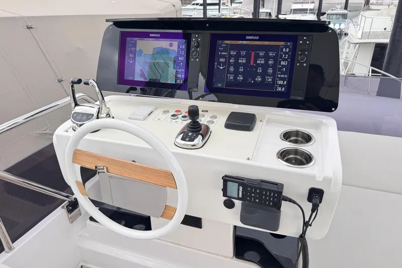  Yacht Photos Pics Helm of 2025 Ferretti Yachts 500 with advanced navigation displays and controls.