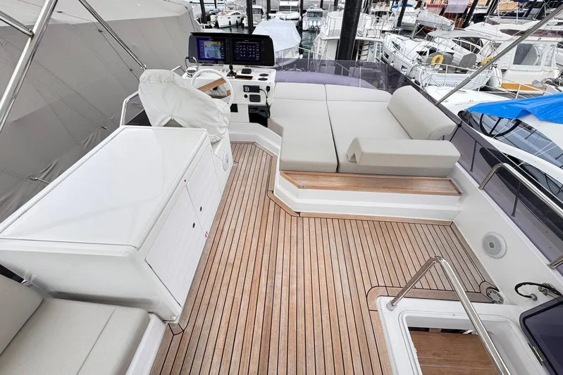  Yacht Photos Pics 2025 Ferretti Yachts 500 flybridge with teak decking and modern helm station.