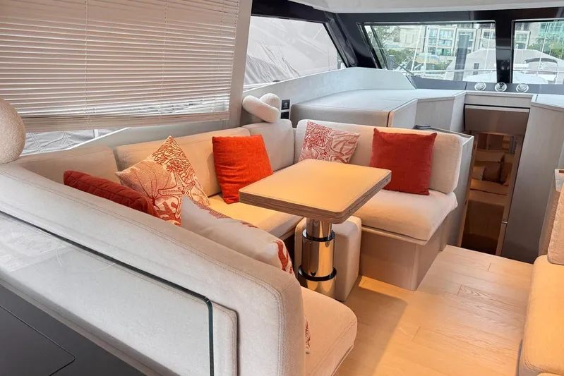  Yacht Photos Pics Luxurious interior of 2025 Ferretti Yachts 500 with elegant seating and vibrant cushions.