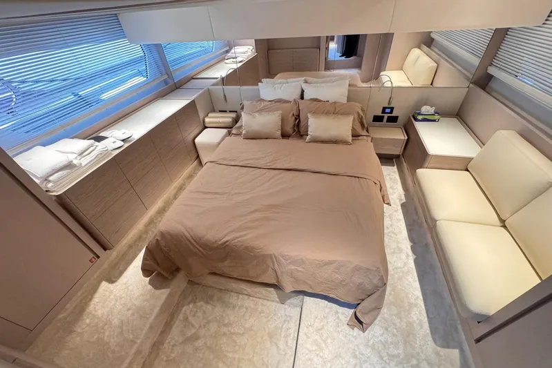  Yacht Photos Pics Luxurious bedroom interior of 2025 Ferretti Yachts 500, featuring elegant design and comfortable furnishings.