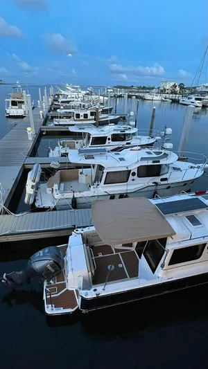  Yacht Photos Pics 2025 Ranger Tugs R-29 CB boats docked at a marina during twilight.