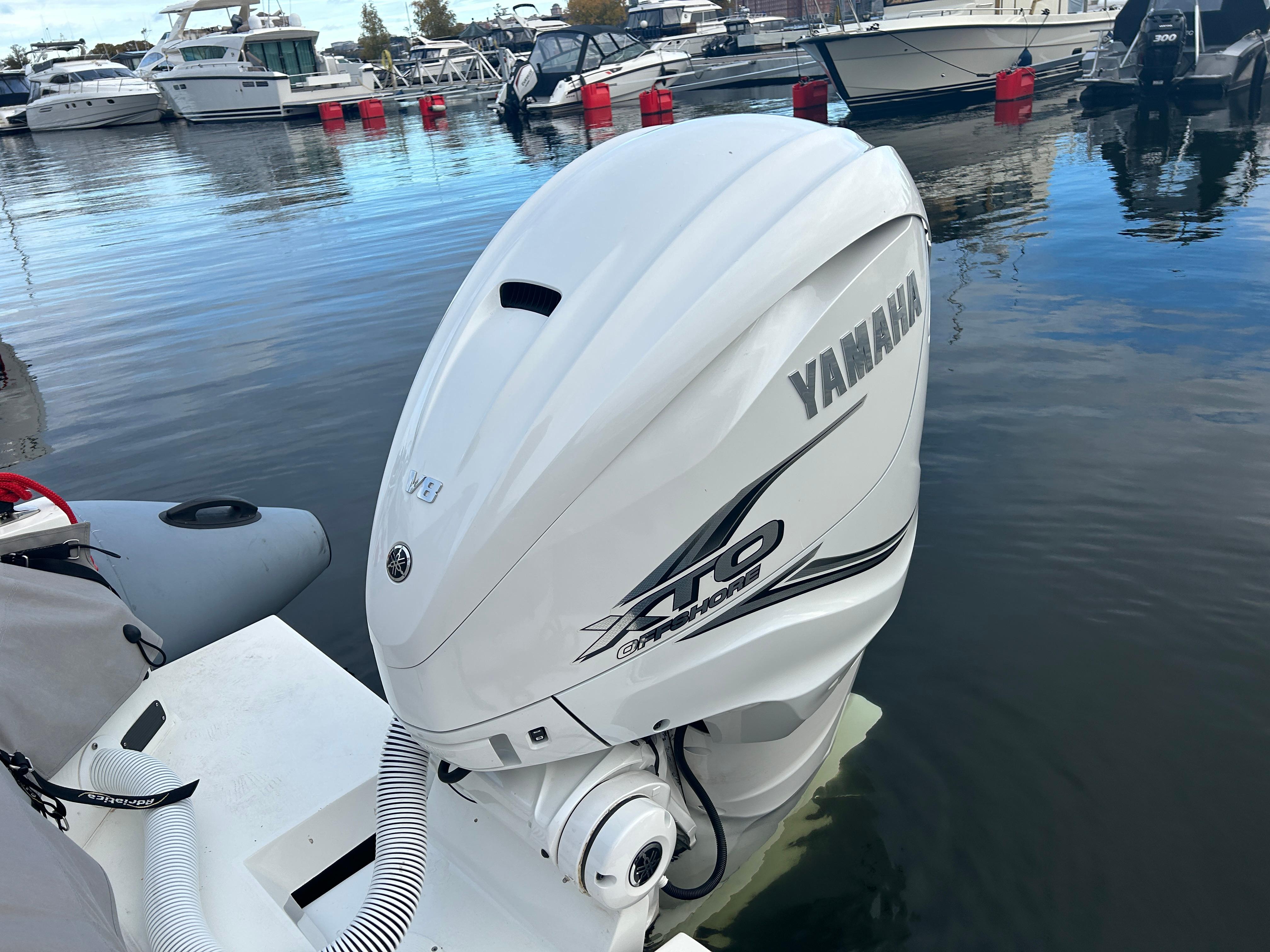 Yamaha XTO outboard motor on Agapi 950 boat, docked in marina, 2018 model.