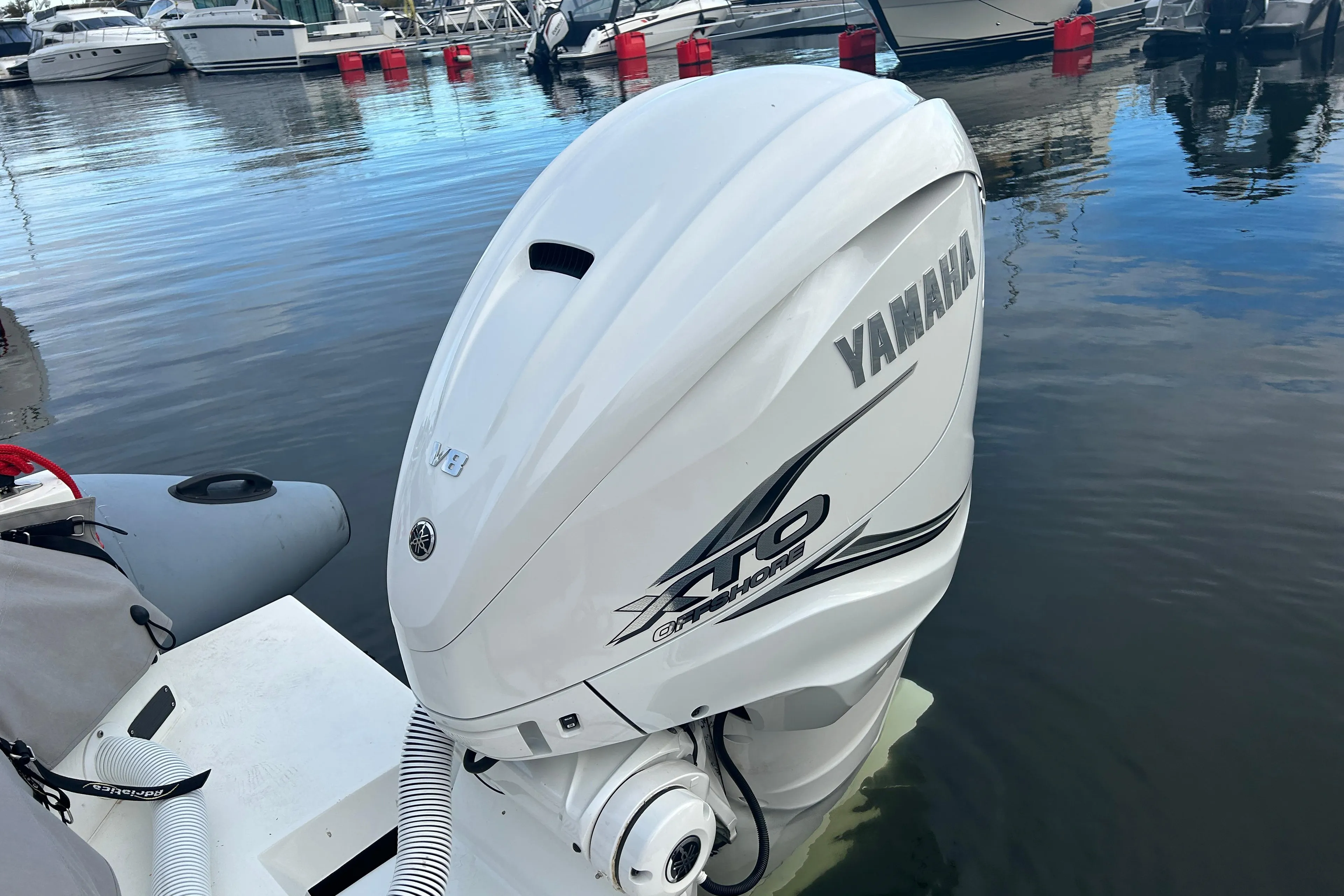 Yamaha XTO outboard motor on Agapi 950 boat, docked in marina, 2018 model.
