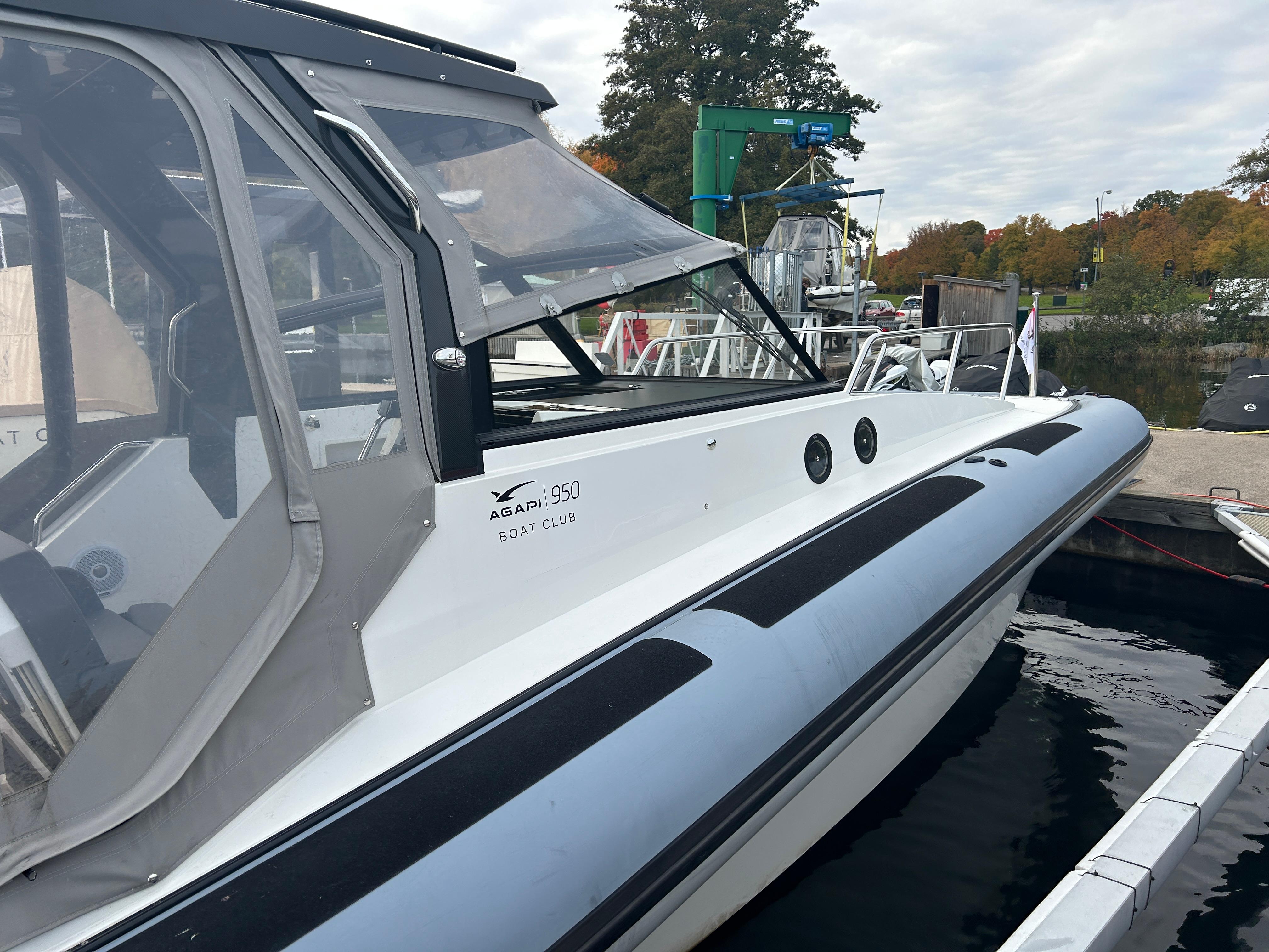 2018 Agapi 950 boat docked, featuring sleek design and modern canopy.