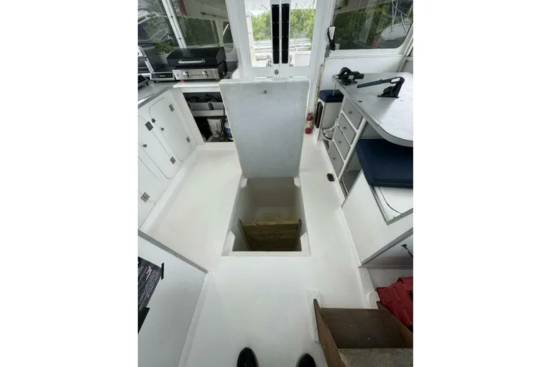 Annabel C Yacht Photos Pics Interior of 1987 Monroe Custom 52 boat with open hatch and kitchen area.